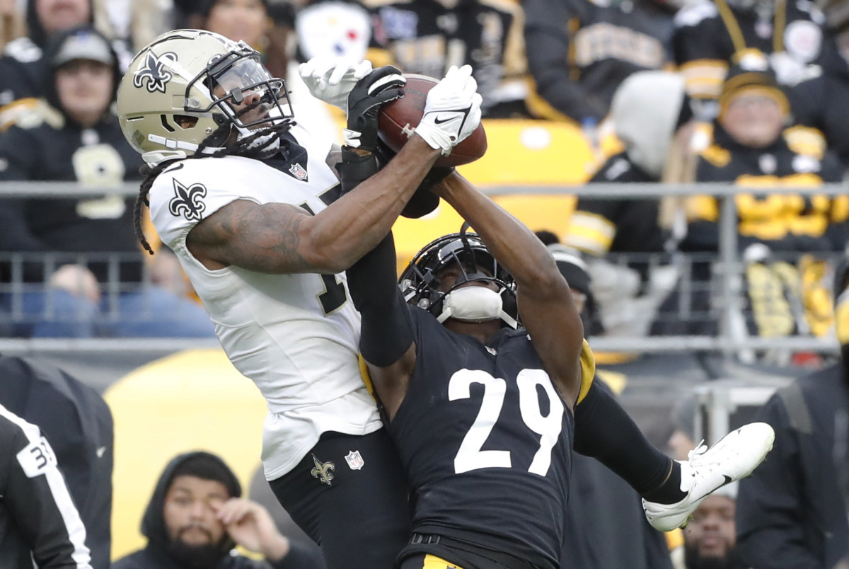 Nov 13, 2022; Pittsburgh, Pennsylvania, USA; Pittsburgh Steelers cornerback Levi Wallace (29) intercepts a pass intended for New Orleans Saints wide receiver Kevin White (17) during the fourth quarter against at Acrisure Stadium. The Steelers won 20-10. Mandatory Credit: Charles LeClaire-USA TODAY Sports