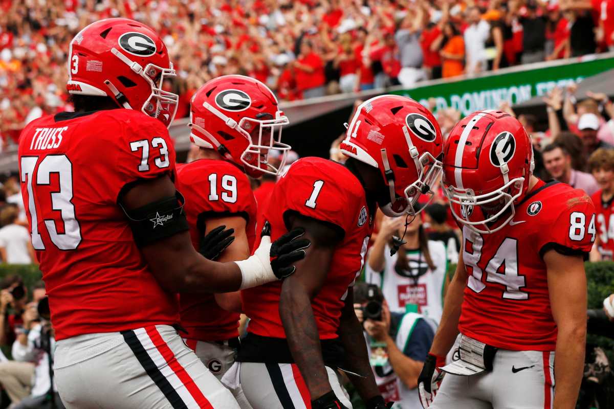 Georgia receiver Ladd McConkey celebrates with his teammates after scoring a touchdown