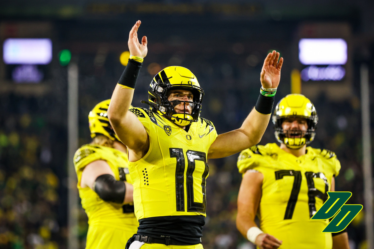 Oregon Ducks quarterback Bo Nix celebrates a touchdown against the Washington Huskies. 