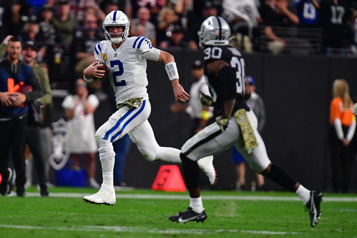 Nov 13, 2022; Paradise, Nevada, USA; Indianapolis Colts quarterback Matt Ryan (2) runs the ball against Las Vegas Raiders safety Duron Harmon (30) during the second half at Allegiant Stadium. Mandatory Credit: Gary A. Vasquez-USA TODAY Sports