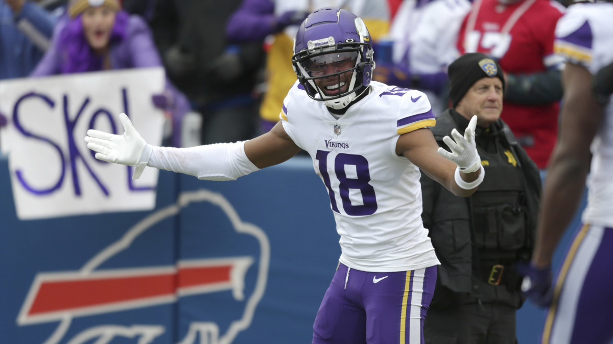 Justin Jefferson gestures after scoring a touchdown early in the Vikings' victory over the Bills