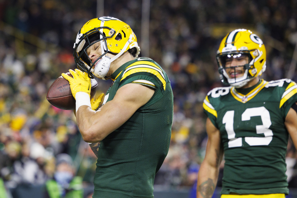 Green Bay Packers wide receiver Christian Watson (9) celebrates after scoring a touchdown during the fourth quarter against the Dallas Cowboys at Lambeau Field.