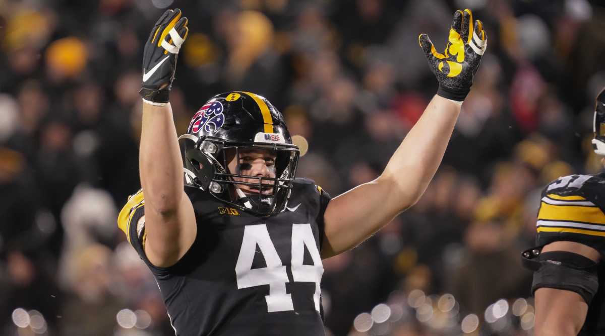 Iowa linebacker Seth Benson fires up the crowd