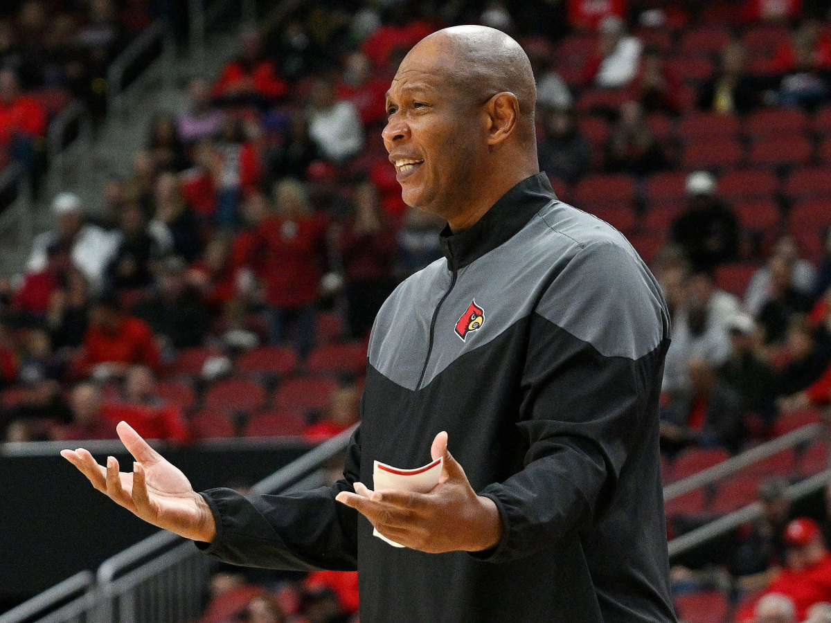 Kenny Payne throws out his hands