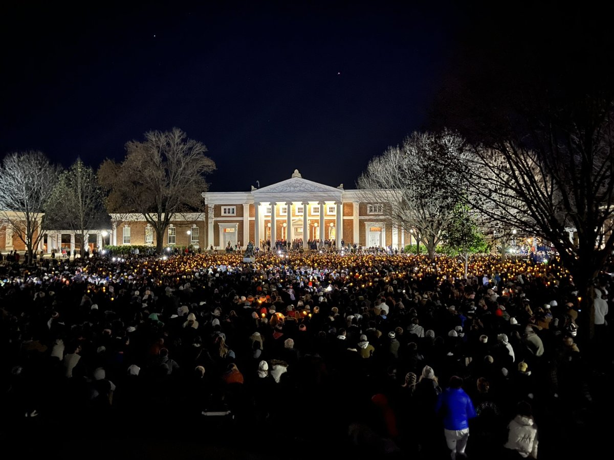 Students and other members of the University of Virginia community gather for a vigil in front of Old Cabell Hall on the Lawn on Monday night in Charlottesville, Virginia following the fatal shootings of three UVA football players.