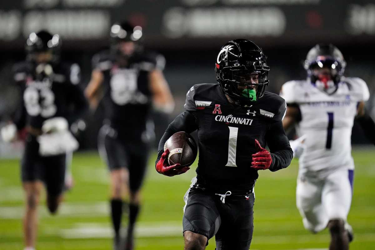Cincinnati Bearcats wide receiver Tre Tucker (1) runs in a catch for a touchdown in the second quarter of the NCAA American Athletic Conference game between the Cincinnati Bearcats and the East Carolina Pirates at Nippert Stadium in Cincinnati on Friday, Nov. 11, 2022. East Carolina Pirates At Cincinnati Bearcats Football
