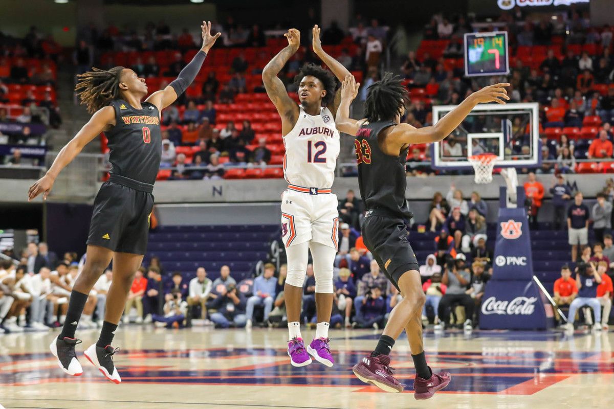 Zep Jasper hits a three to start the game vs Winthrop.