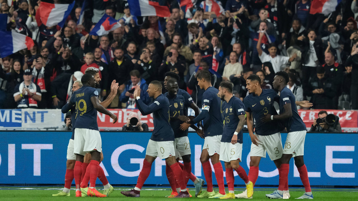 French players celebrate on the pitch