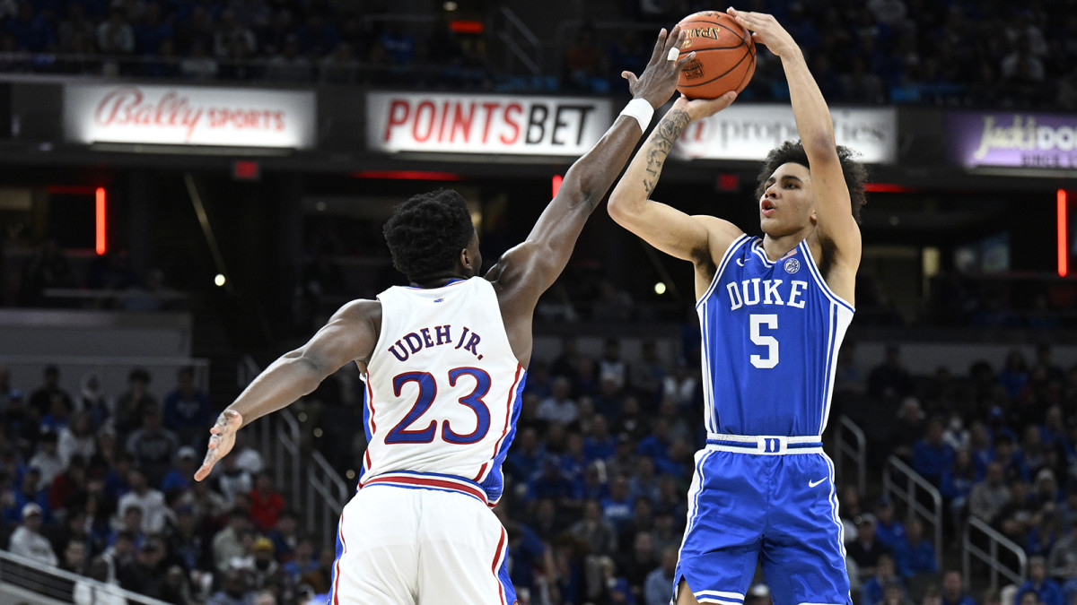 Duke Blue Devils guard Tyrese Proctor (5) shoots the ball over Kansas Jayhawks center Ernest Udeh Jr.