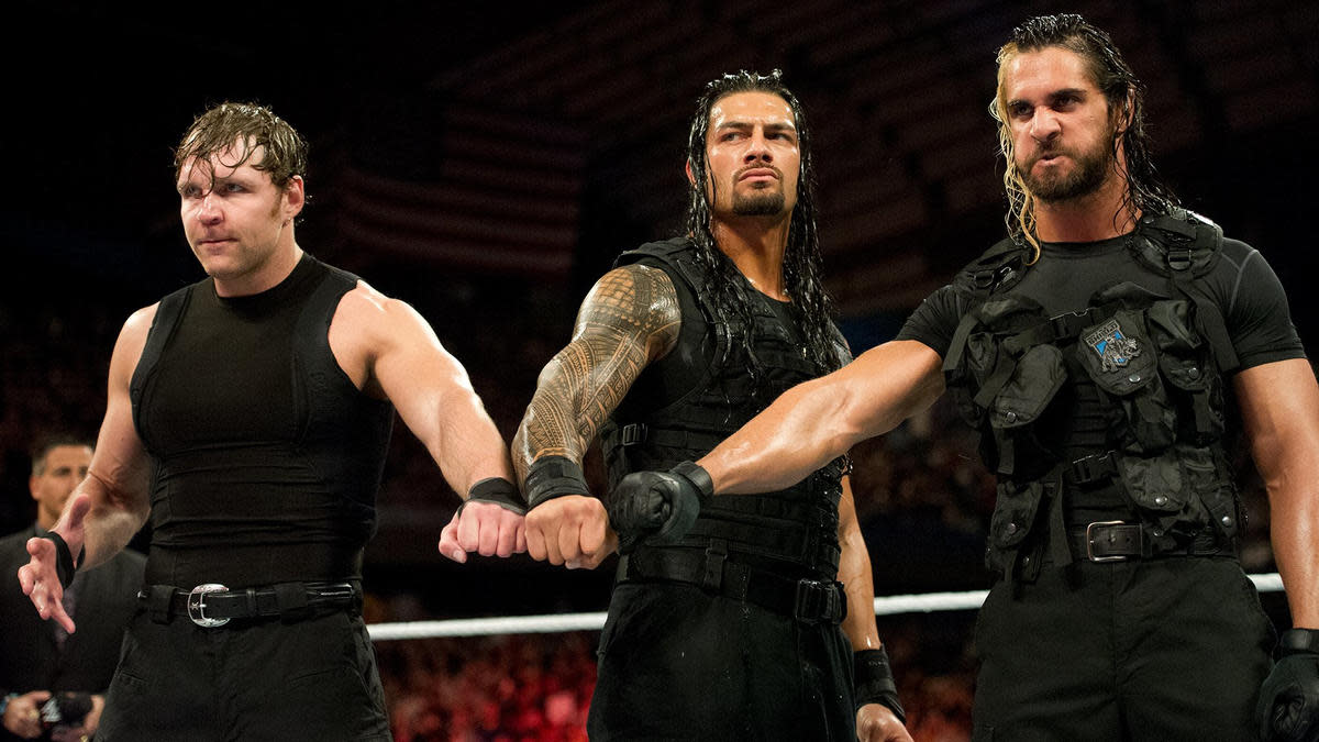 Dean Ambrose, Roman Reigns and Seth Rollins in the ring as The Shield