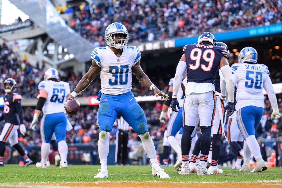 Nov 13, 2022; Chicago, Illinois, USA; Detroit Lions running back Jamaal Williams (30) celebrates his rushing touchdown in the fourth quarter against the Chicago Bears at Soldier Field.