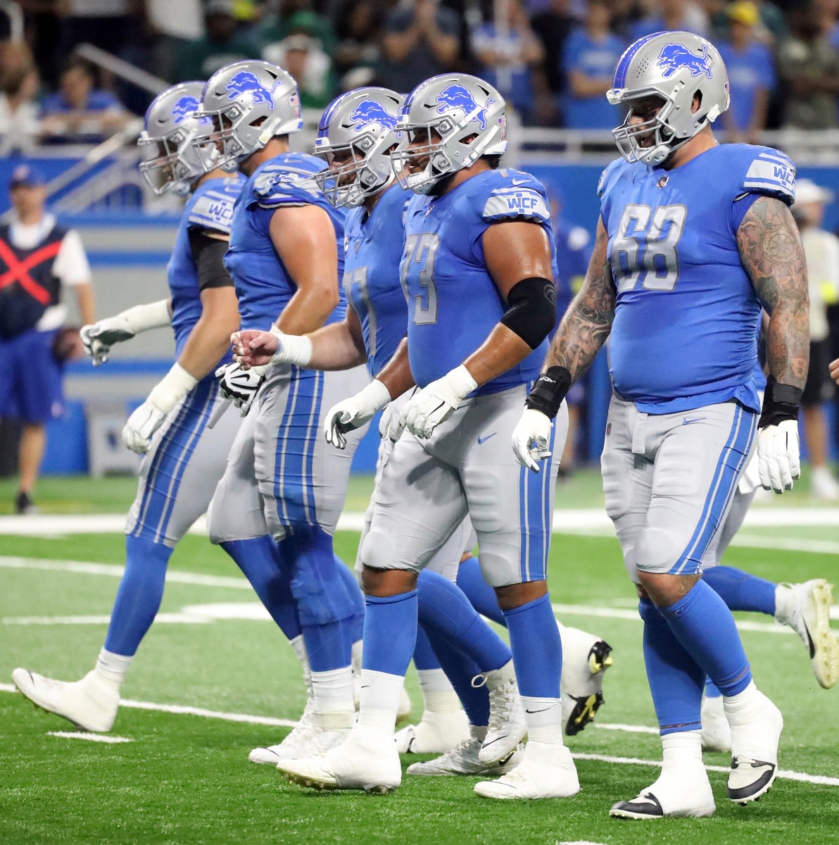 Detroit Lions offensive line, including left tackle Taylor Decker (68) and left guard Jonah Jackson (73), lines up against the Philadelphia Eagles during the first half at Ford Field, Sept. 11, 2022.