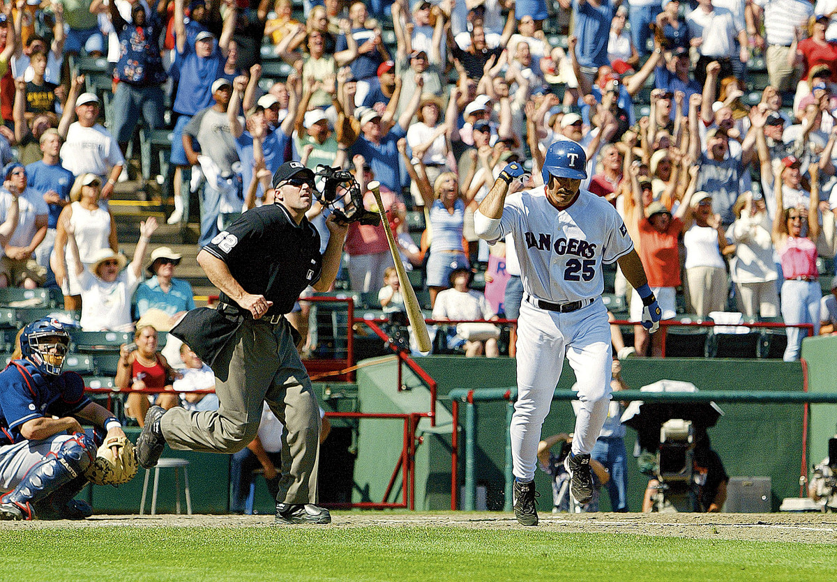 Rafael Palmeiro flips his bat after hitting his 500th career home run on May 11, 2003.