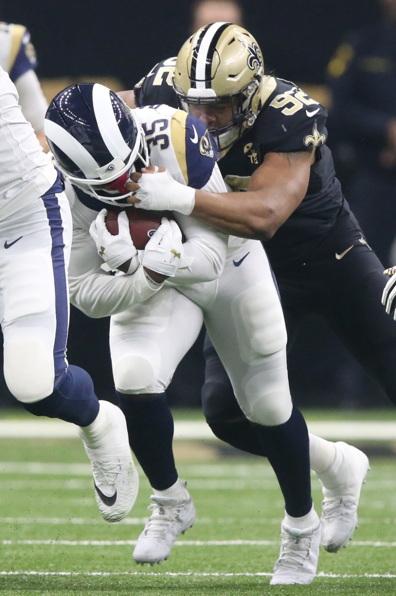 Jan 20, 2019; New Orleans Saints defensive end Marcus Davenport (92) tackles Los Angeles Rams running back C.J. Anderson (35). Mandatory Credit: Chuck Cook-USA TODAY Sports