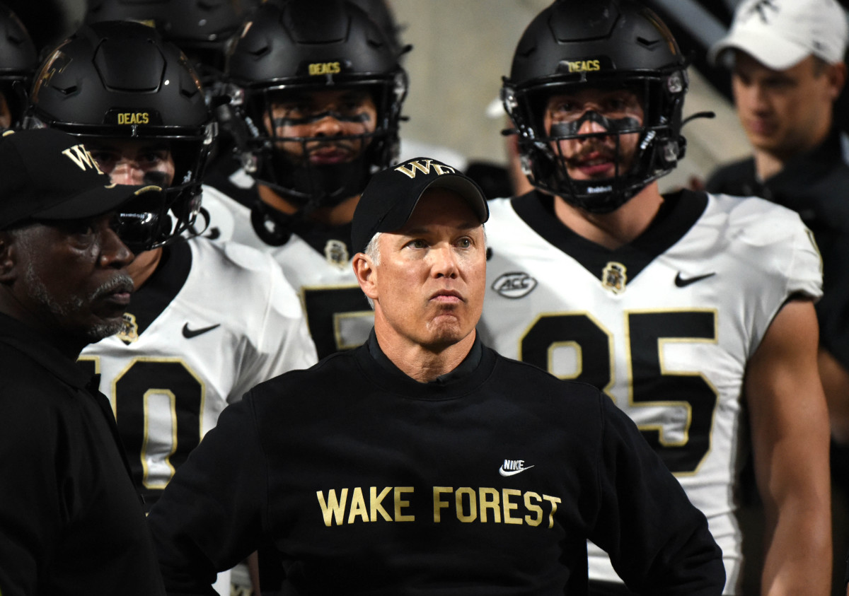 Nov 5, 2022; Raleigh, North Carolina, USA; Wake Forest Demon Deacons head coach Dave Clawson (center) prepares to lead his team onto the field prior to a game against the North Carolina State Wolfpack at Carter-Finley Stadium. Mandatory Credit: Rob Kinnan-USA TODAY Sports