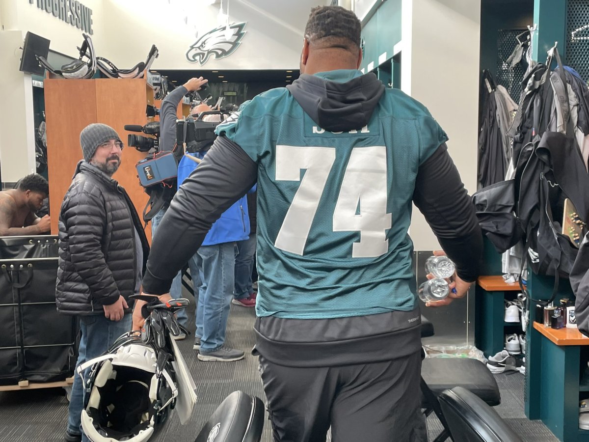 Ndamukong Suh enters the locker room on his first day as a member of the Eagles