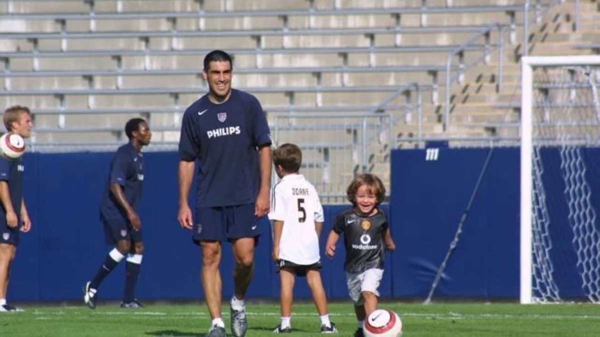 Claudio Reyna and Gio Reyna on the field at USMNT camp