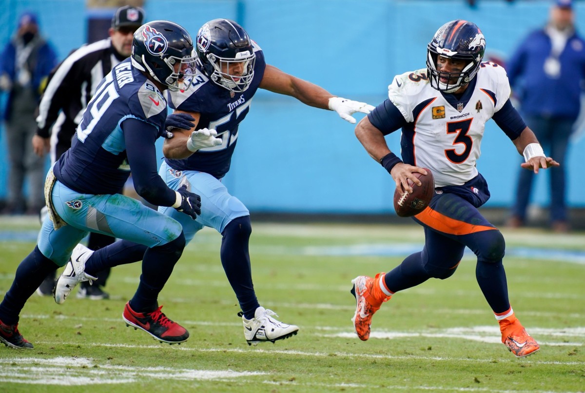 Tennessee Titans linebackers Rashad Weaver (99) and Dylan Cole (53) chase Denver Broncos quarterback Russell Wilson (3) during the fourth quarter at Nissan Stadium Sunday, Nov. 13, 2022, in Nashville, Tenn. Nfl Denver Broncos At Tennessee Titans