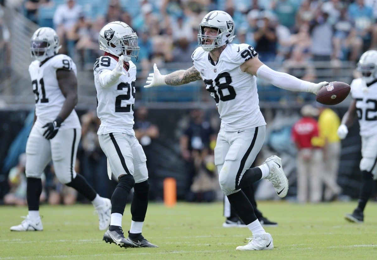 Las Vegas Raiders defensive end Maxx Crosby (98) runs to the sidelines after picking up a fumbled ball from Jacksonville Jaguars running back JaMycal Hasty (22) during early first quarter action. The Jacksonville Jaguars hosted the Las Vegas Raiders at TIAA Bank Field in Jacksonville, FL Sunday November 6, 2022. The Jaguars trailed 20 to 10 at the end of the first half. [Bob Self/Florida Times-Union] Jki 110622 Bs Jaguars Vs R 37