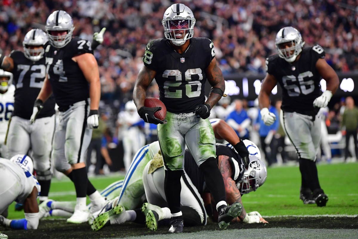 Nov 13, 2022; Paradise, Nevada, USA; Las Vegas Raiders running back Josh Jacobs (28) celebrates his touchdown scored against the Indianapolis Colts during the second half at Allegiant Stadium. Mandatory Credit: Gary A. Vasquez-USA TODAY Sports
