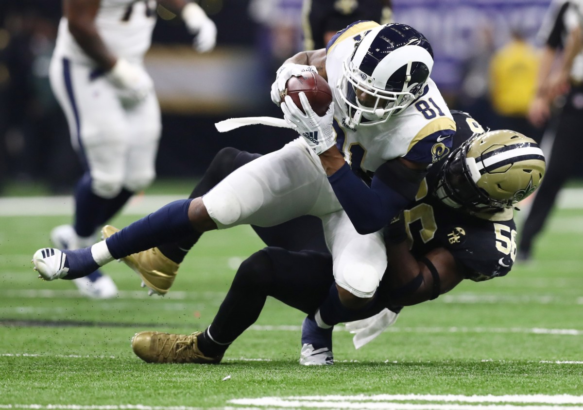 Jan 20, 2019; Los Angeles Rams tight end Gerald Everett (81) is tackled by New Orleans Saints linebacker Demario Davis (56). Mandatory Credit: Matthew Emmons-USA TODAY Sports