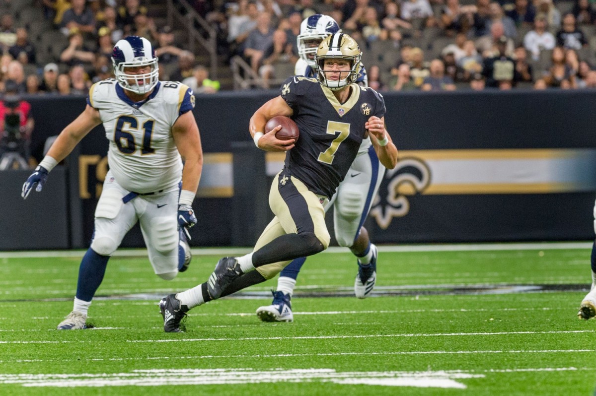 Saints quarterback Taysom Hill runs the ball against the Los Angeles Rams on Thursday, Aug. 30, 2018. © SCOTT CLAUSE/USA TODAY Network