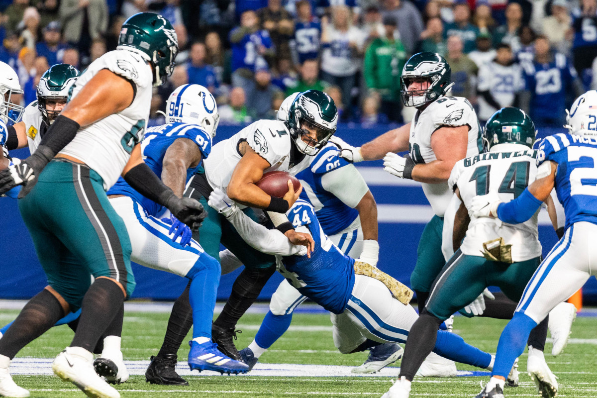Nov 20, 2022; Indianapolis, Indiana, USA; Philadelphia Eagles quarterback Jalen Hurts (1) is sacked by Indianapolis Colts defensive end Yannick Ngakoue (91) and linebacker Zaire Franklin (44) in the first quarter at Lucas Oil Stadium.