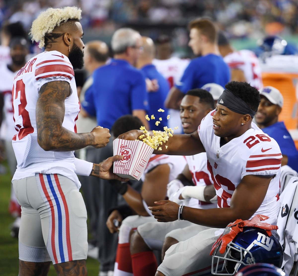 Giants vs. Jets preseason game at MetLife Stadium in East Rutherford on Friday, August 24, 2018. G #13 Odell Beckham Jr. and #26 Saquon Barkley eat popcorn in the fourth quarter.