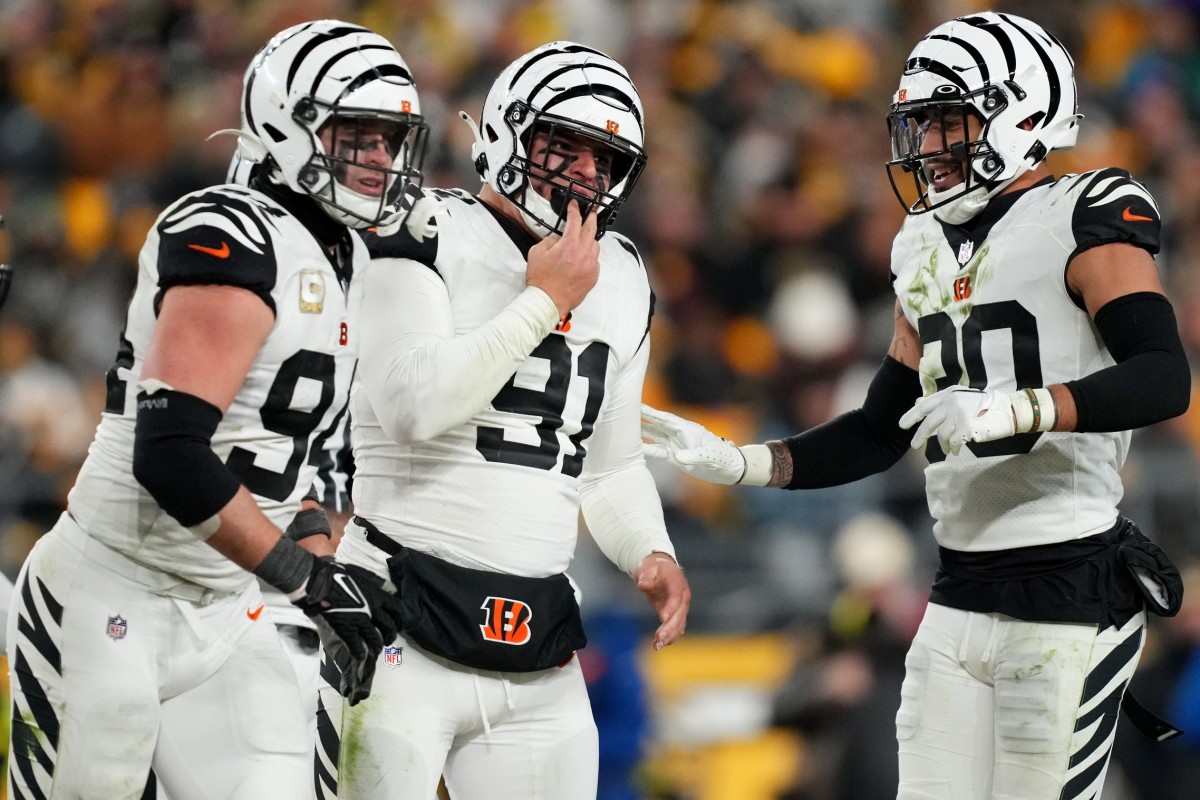 Cincinnati Bengals defensive end Trey Hendrickson (91), center, celebrates a sack with Cincinnati Bengals defensive end Sam Hubbard (94), left, and Cincinnati Bengals safety Jessie Bates III (30), right, in the third quarter during a Week 11 NFL game against the Pittsburgh Steelers, Sunday, Nov. 20, 2022, at Acrisure Stadium in Pittsburgh, Pa. The Cincinnati Bengals won, 37-30. Nfl Cincinnati Bengals At Pittsburgh Steelers Nov 20 0095
