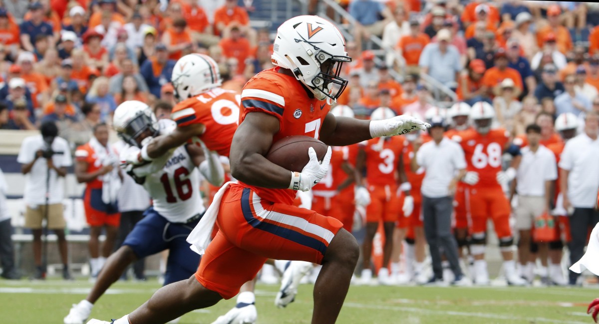 Virginia Cavaliers running back Mike Hollins (7) carries the ball against Richmond Spiders during the first half at Scott Stadium.