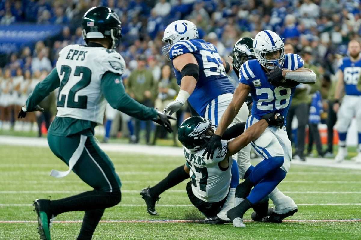 Indianapolis Colts running back Jonathan Taylor (28) is brought down by Philadelphia Eagles linebacker T.J. Edwards (57) on Sunday, Nov. 20, 2022, during a game against the Philadelphia Eagles at Lucas Oil Stadium in Indianapolis.