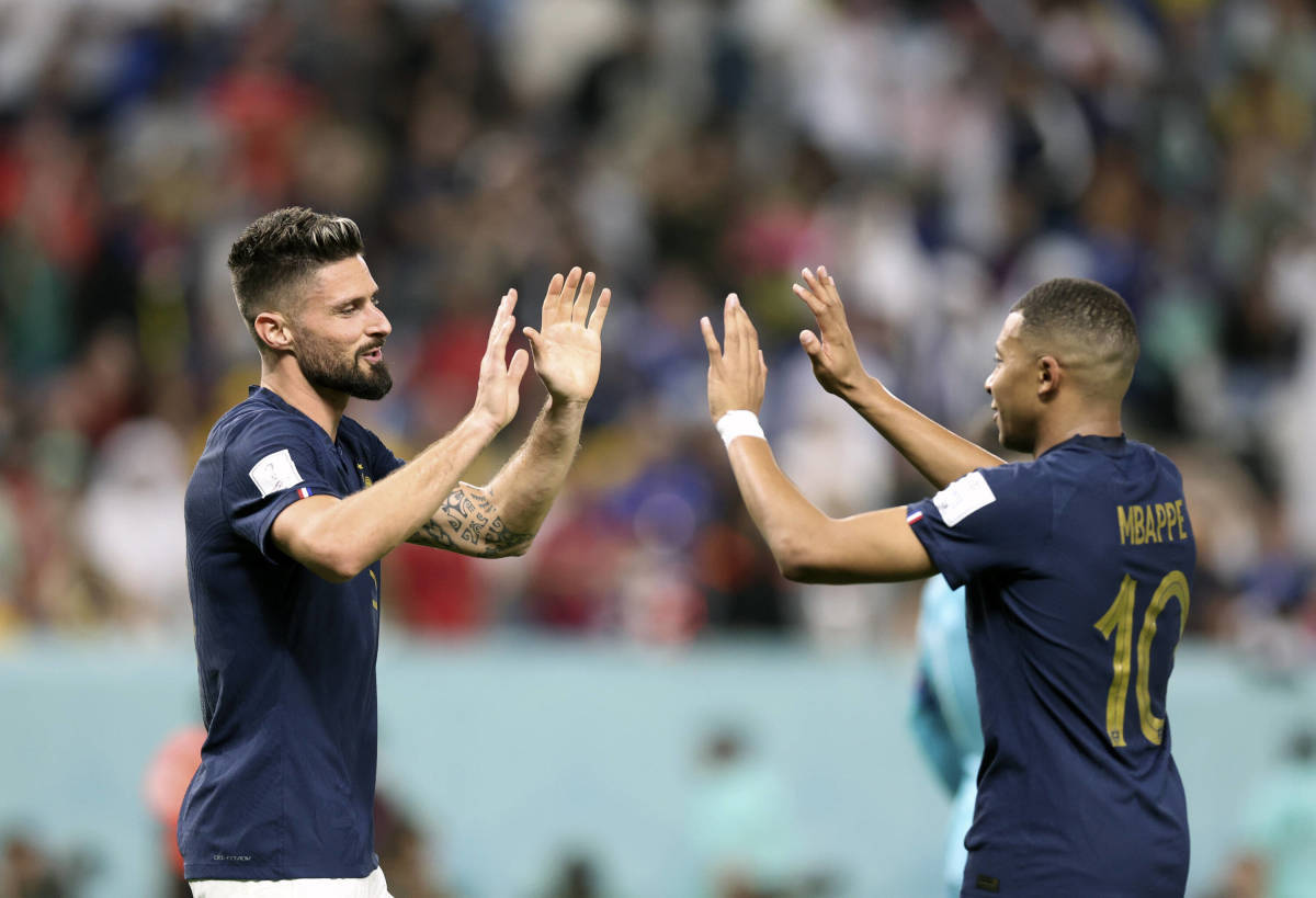 Olivier Giroud (left) and Kylian Mbappe pictured high-fiving during France's 4-1 win over Australia at the 2022 World Cup
