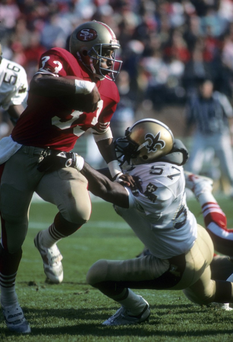 Dec 11, 1988; FILE PHOTO; San Francisco 49ers running back Roger Craig (33) in action against New Orleans Saints linebacker Rickey Jackson (57). Mandatory Credit: Malcolm Emmons-USA TODAY Sports