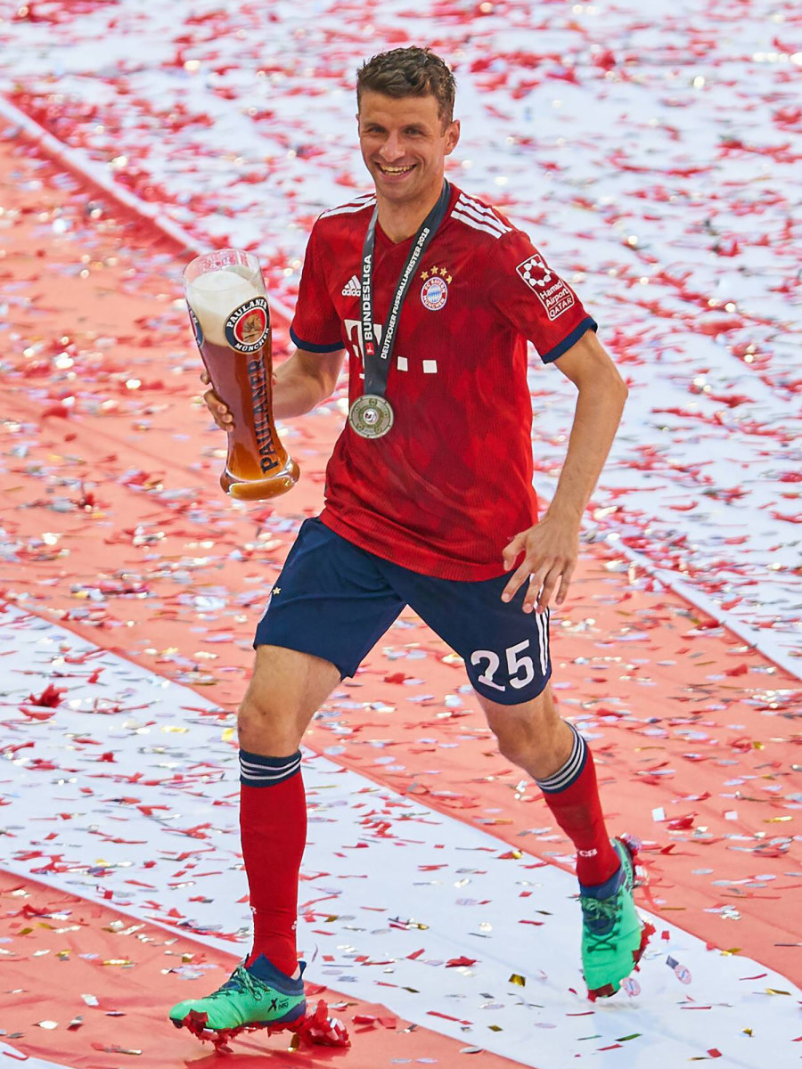 Thomas Muller celebrates a Bundesliga title