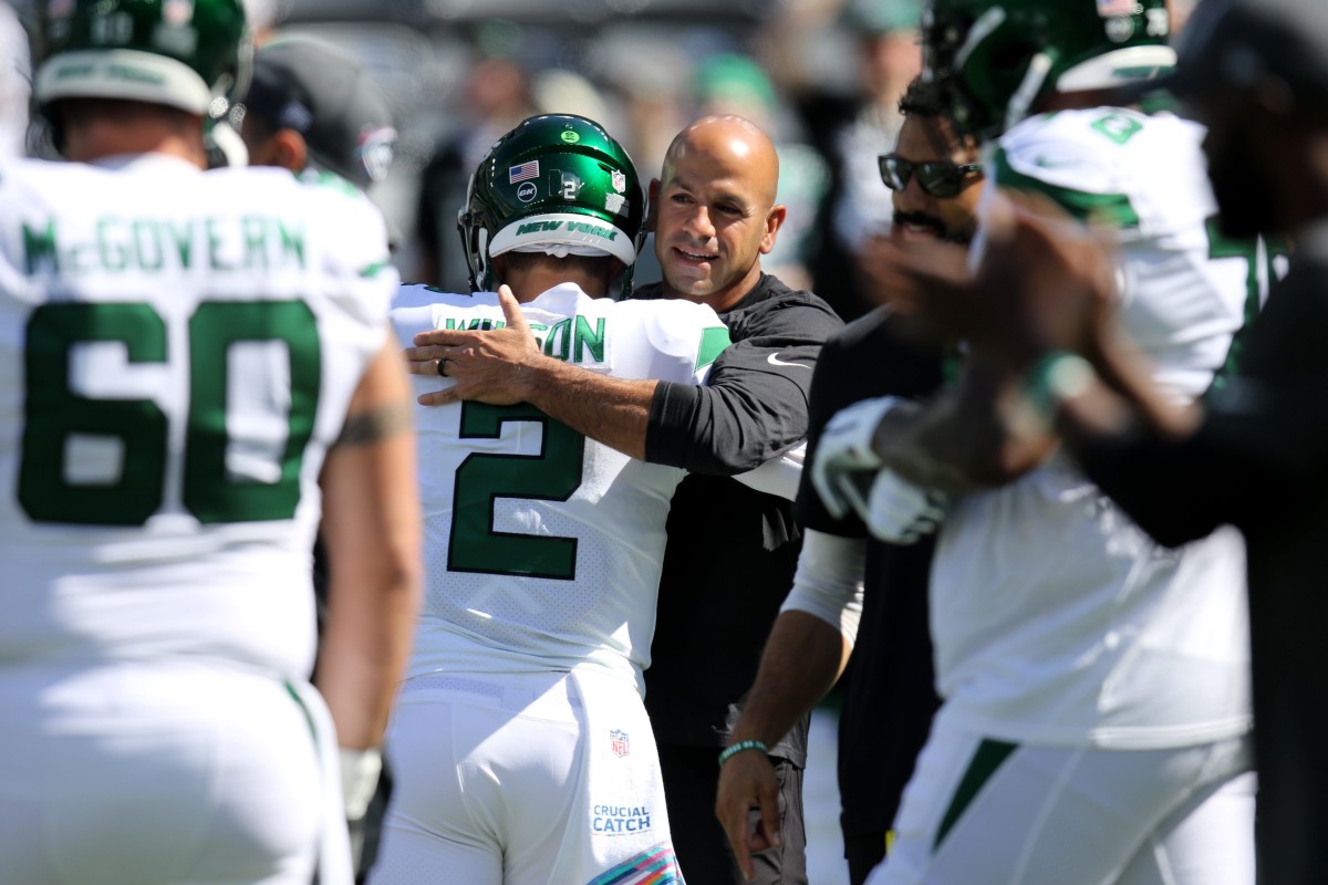 New York Jets HC Robert Saleh hugs Zach Wilson on sideline