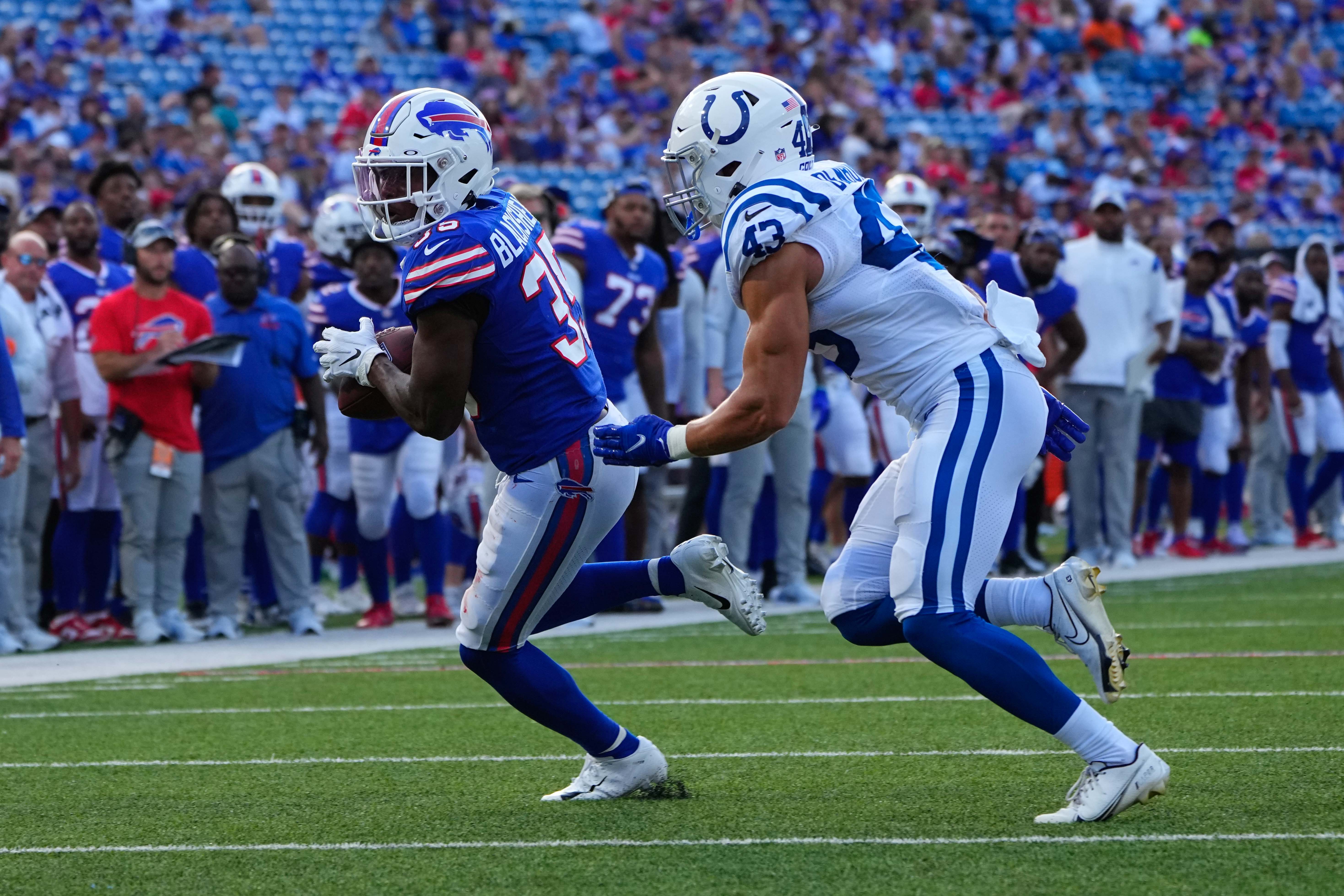 Aug 13, 2022; Orchard Park, New York, USA; Buffalo Bills running back Raheem Blackshear (35) makes a catch with Indianapolis Colts safety Trevor Denbow (43) defending during the second half at Highmark Stadium.