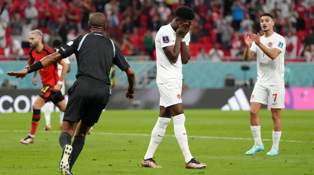 Canada’s Alphonso Davies reacts after missing a penalty vs. Belgium.