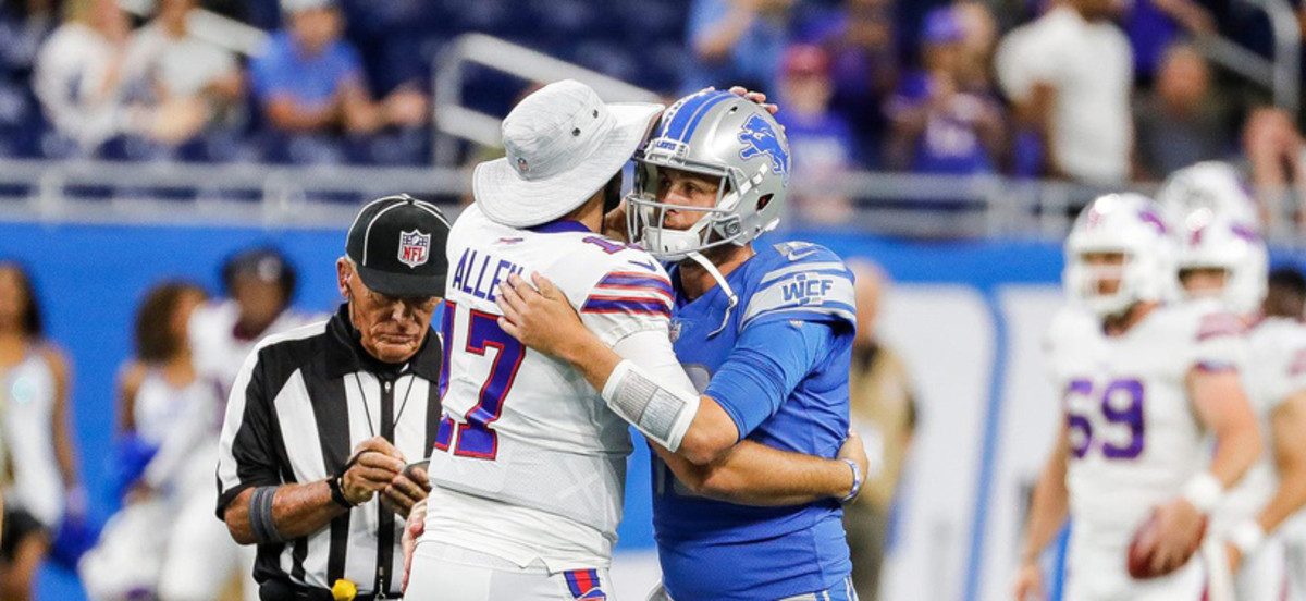 Detroit Lions quarterback Jared Goff embraces Buffalo Bills quarterback Josh Allen