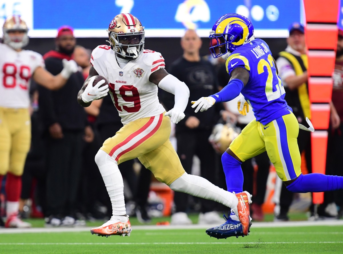 Jan 30, 2022; San Francisco 49ers receiver Deebo Samuel (19) gets past Los Angeles Rams defensive back David Long (22) for a touchdown in the first half during the NFC Championship Game. Mandatory Credit: Gary A. Vasquez-USA TODAY Sports