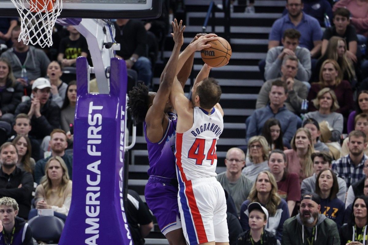 Utah Jazz guard Collin Sexton (2) fouls Detroit Pistons forward Bojan Bogdanovic (44) while shooting during the second half at Vivint Arena.