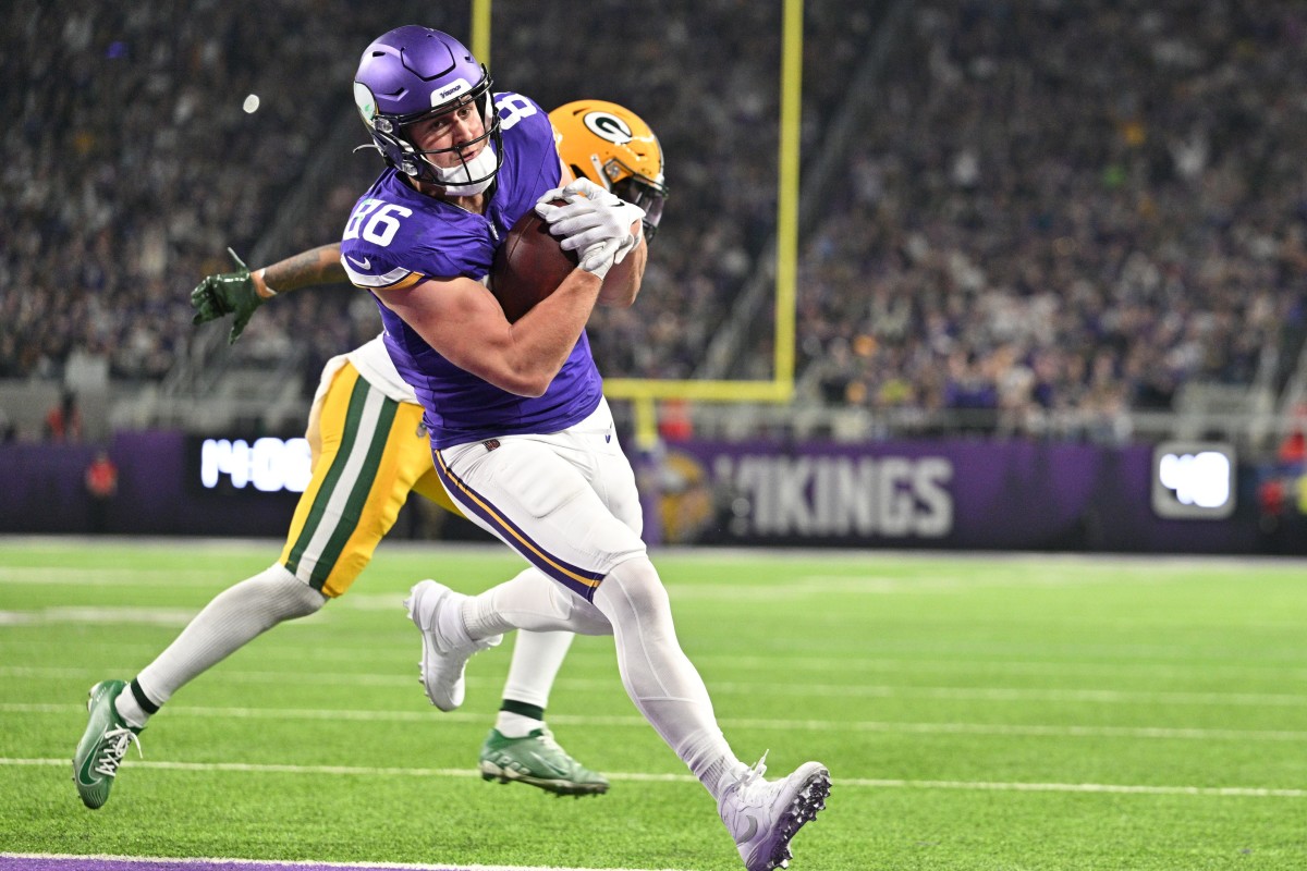 Dec 31, 2023; Minneapolis, Minnesota, USA; Minnesota Vikings tight end Johnny Mundt (86) scores a touchdown during the fourth quarter against the Green Bay Packers at U.S. Bank Stadium.
