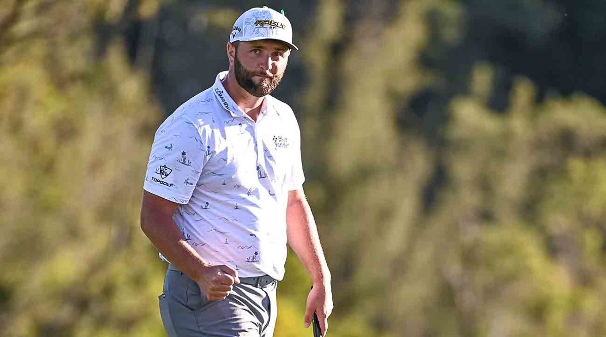 Jon Rahm fist pumps while making a putt at the 2022 Sentry Tournament of Champions in Kapalua, Maui, Hawaii.