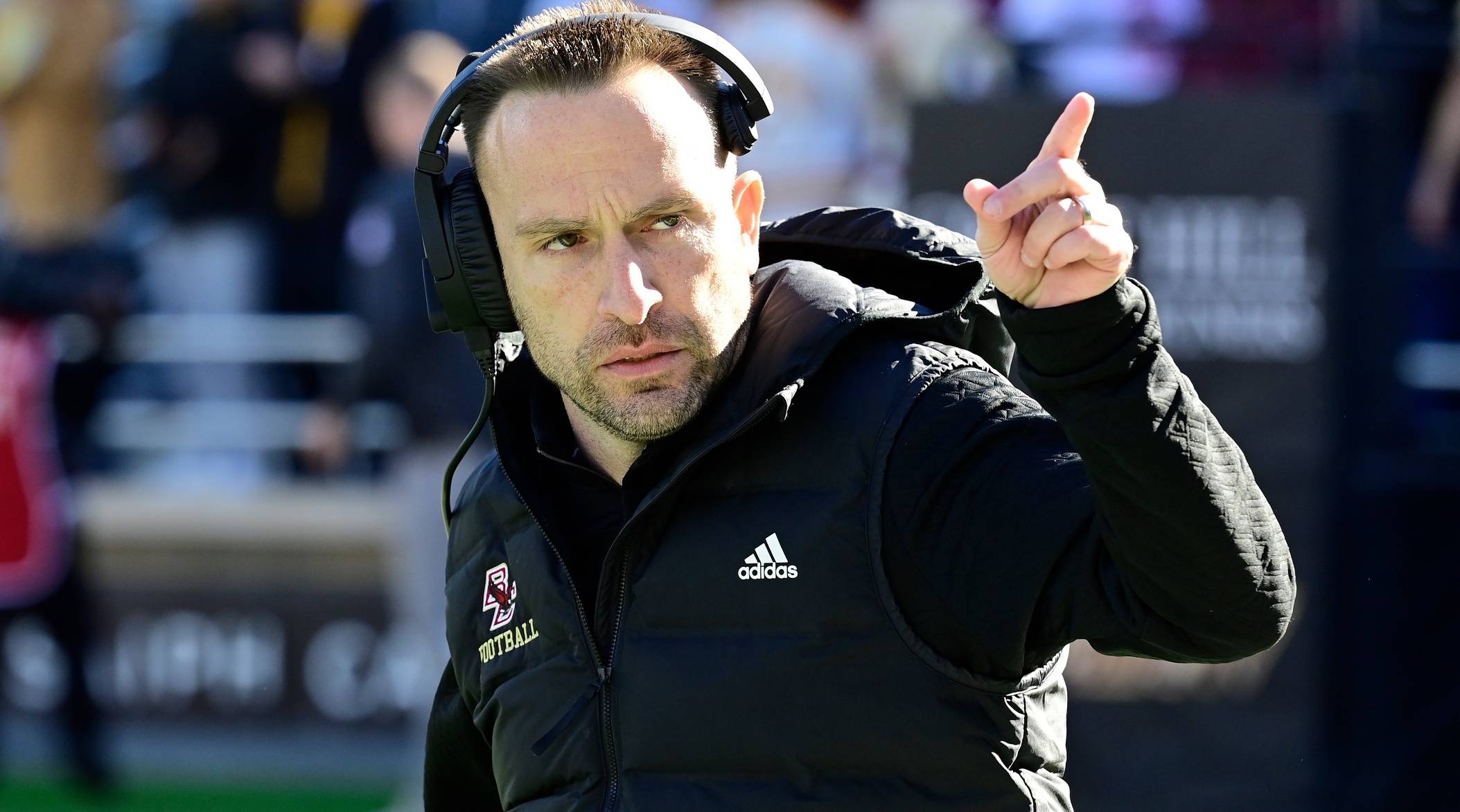 Boston College head coach Jeff Hafley points up during a game.