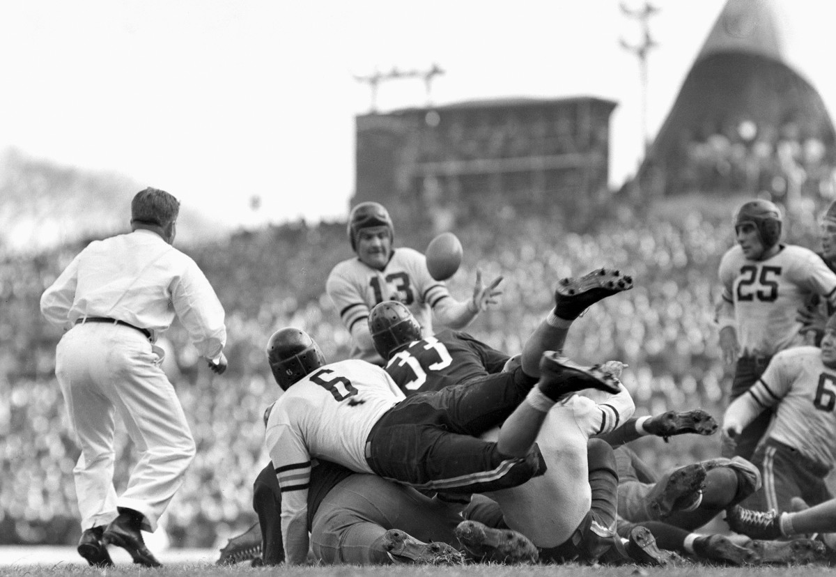 Chicago Bears lineman, gathers in a fumbled ball, dropped by Sammy Baugh