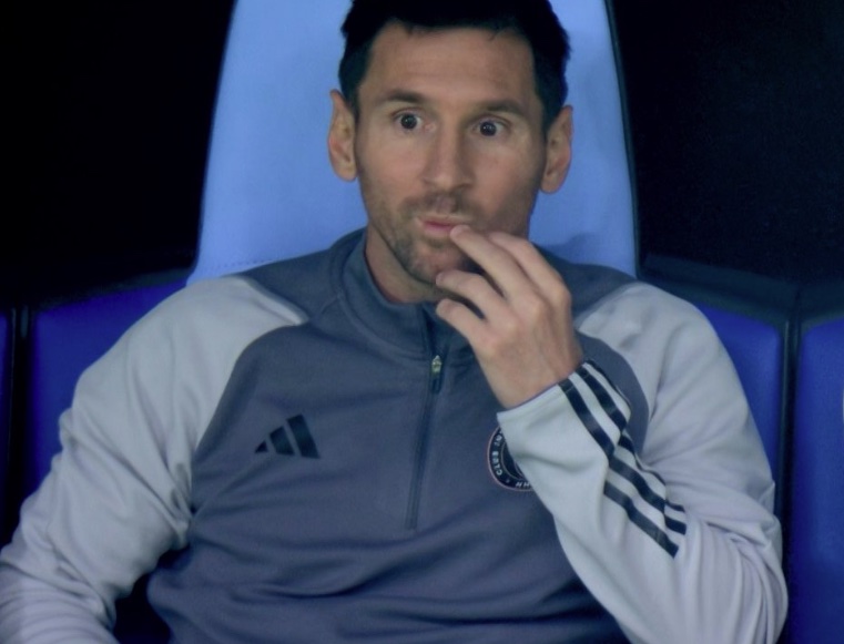 Lionel Messi pictured looking shocked on the Inter Miami bench after seeing his team concede three goals inside the first 12 minutes of a game against Al Nassr in February 2024