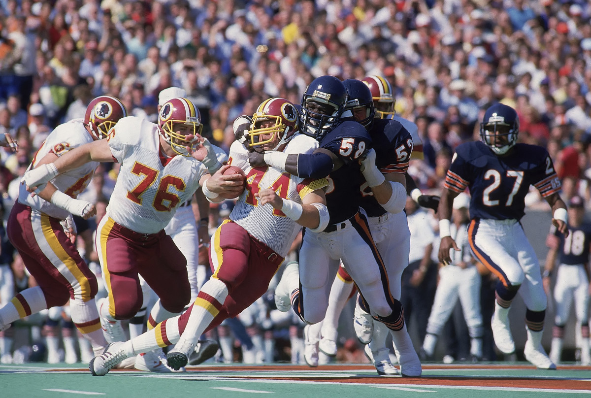 John Riggins is tackled by Wilbur Marshall