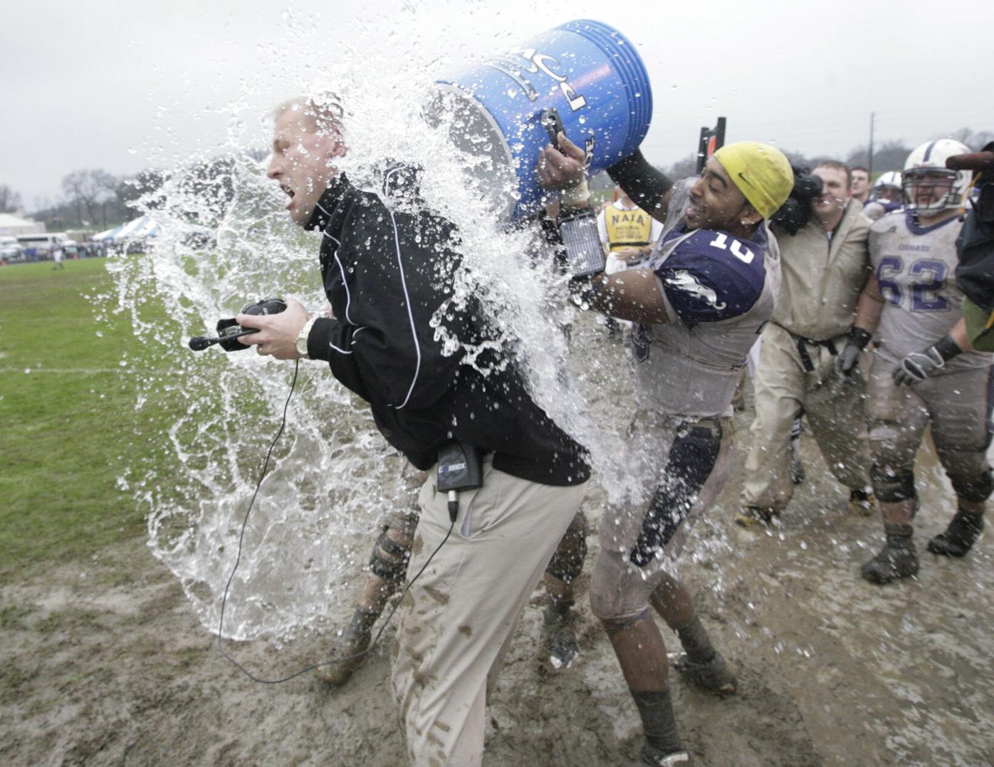 Brown Jr. douses DeBoer in an ice bath after defeating Van Diest's Carroll College in the 2008 Division-II National Championship game.