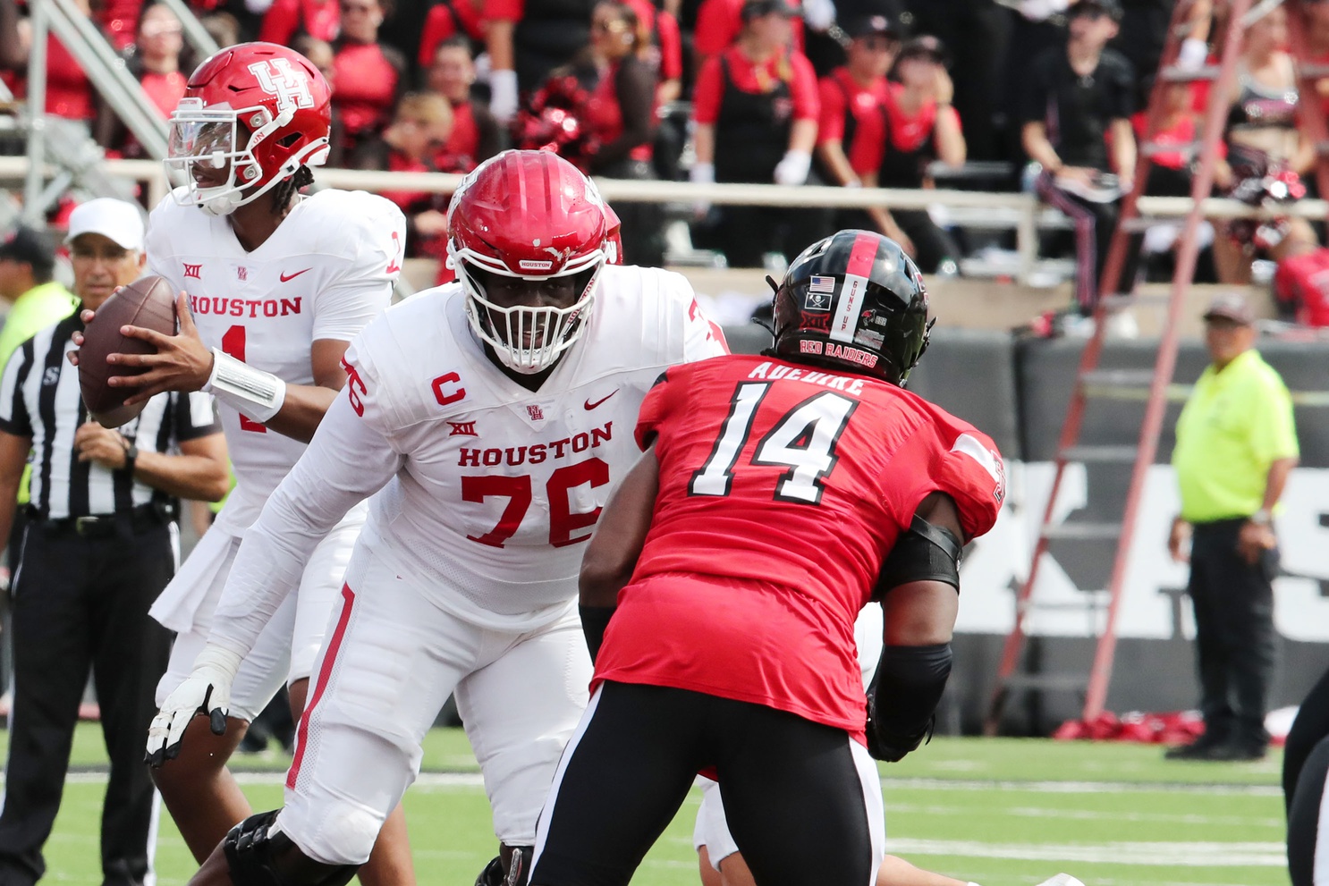 Sep 30, 2023; Lubbock, Texas, USA; Houston Cougars offensive tackle Patrick Paul (76) blocks Texas Tech Red Raiders defensive end Joseph Adedire (14) in the second half at Jones AT&T Stadium and Cody Campbell Field.