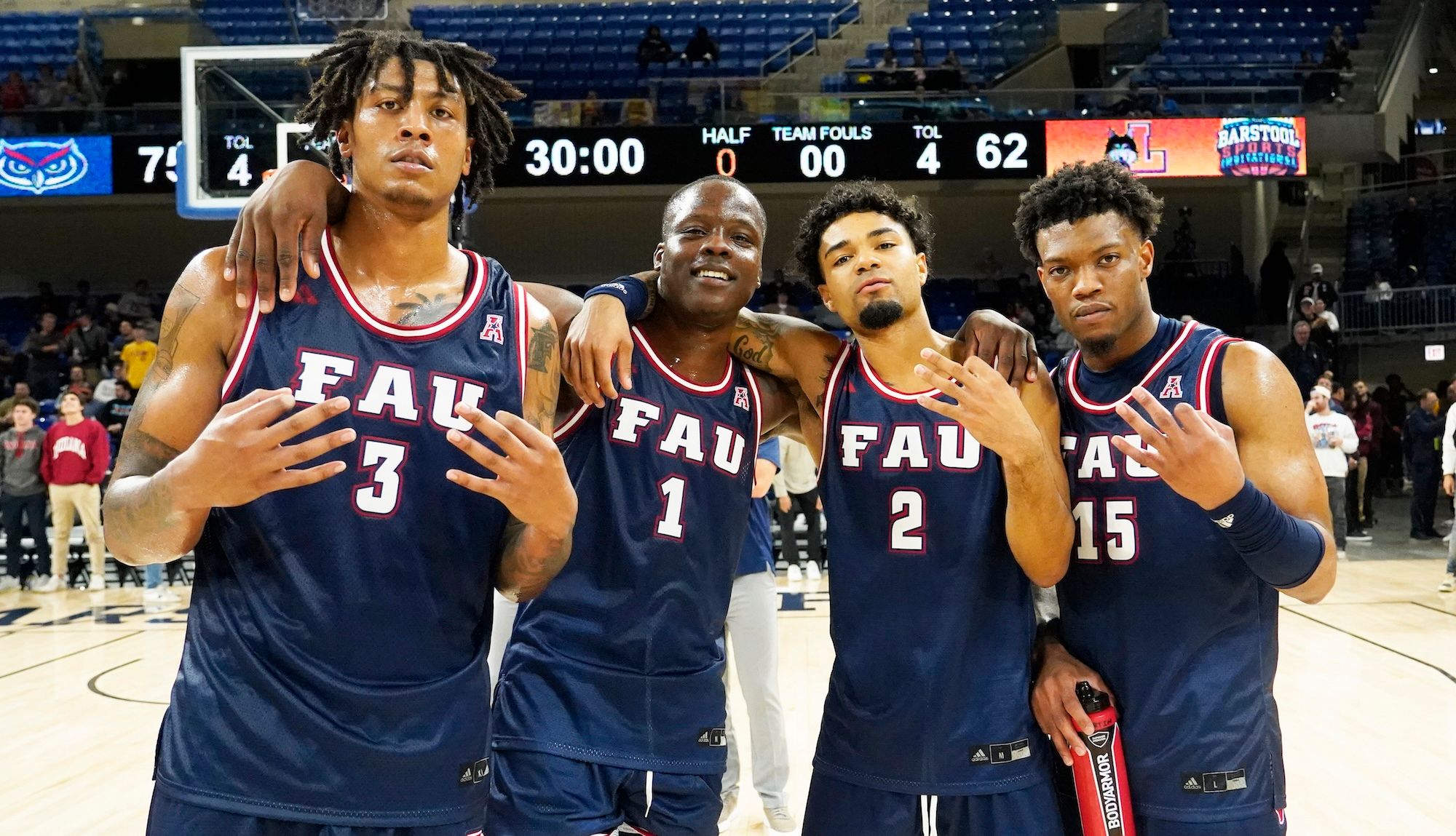Rosado, Davis, Boyd and Martin celebrate their win against the Loyola Ramblers.