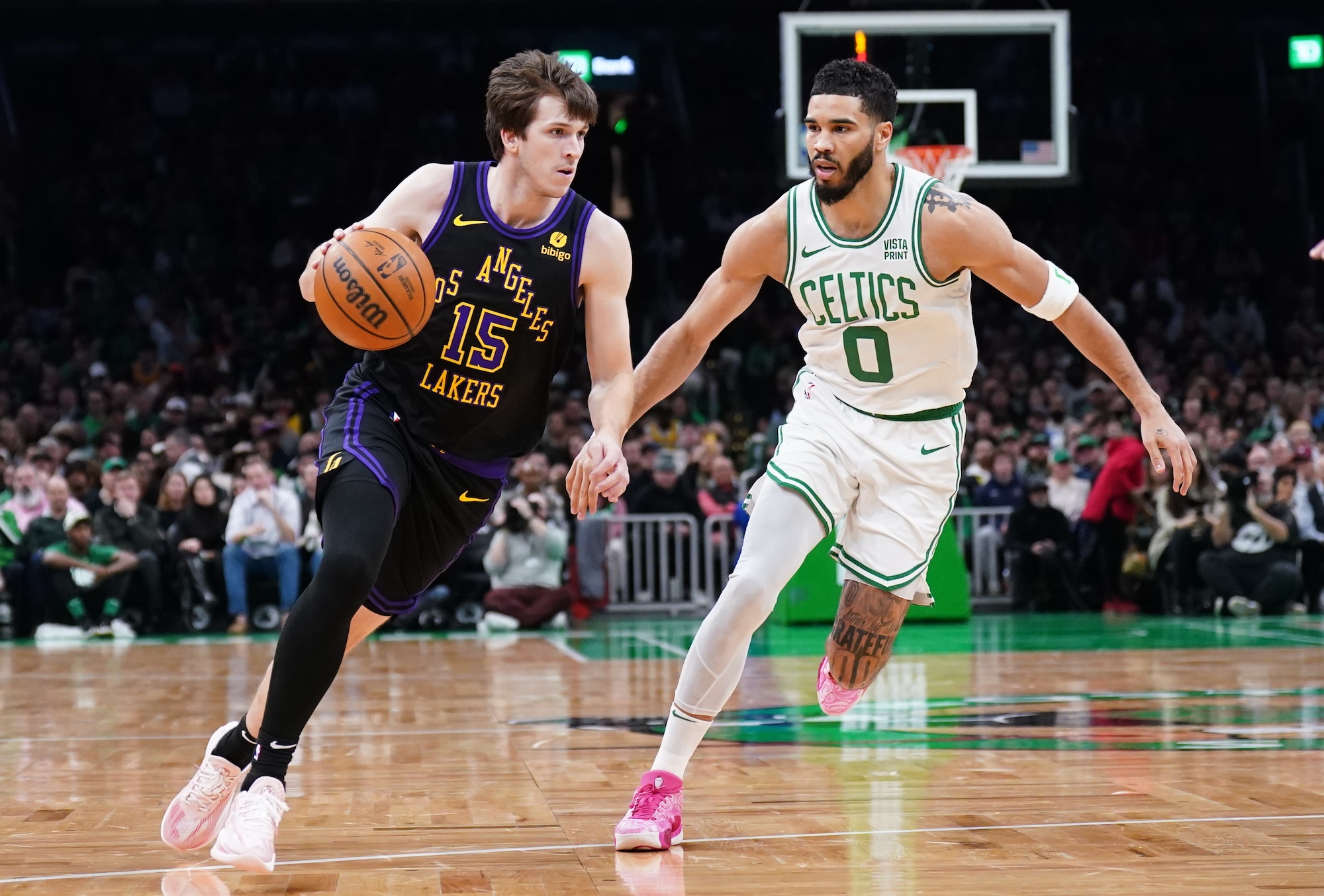 Los Angeles Lakers guard Austin Reaves drives the ball against Boston Celtics forward Jayson Tatum in the first quarter at TD Garden in Boston on Thursday.